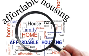Magnifying-glass-highlighting-affordable-housing-family-home-and-rent-concepts-related-to-Public-Housing-UK