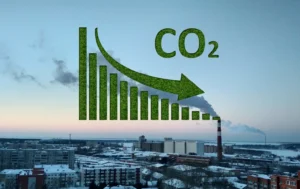 Cityscape-with-industrial-smokestack-and-decreasing-CO2-graph-symbolising-Social-Housing-Decarbonisation-Fund