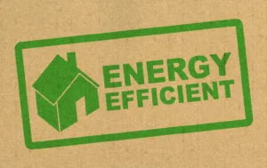Green-house-icon-and-energy-efficient-text-on-cardboard-background-representing-Social-Housing-Decarbonisation-Fund.