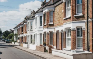 Row-of-brick-houses-on-a-street-illustrating-the-Supported-Housing-Crisis.