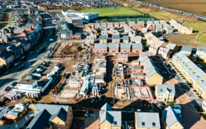 An-aerial-view-of-a-growing-housing-area-highlighting-the-potential-of-Property-Rent-Guarantees-for-landlords-seeking-stability