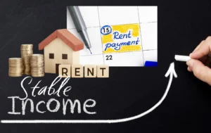 Wooden-blocks-spelling-RENT-with-coins-and-a-calendar-highlighting-Rent-payment-in-the-context-of-stable-income-and-guaranteed-rent