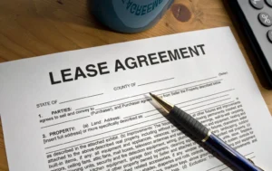 Lease-agreement-document-with-a-pen-and-calculator-representing-Government-Backed-Leases