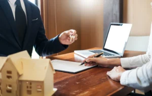 Signing-a-lease-agreement-with-keys-being-handed-over-symbolizing-Government-Backed-Leases-in-property-investment