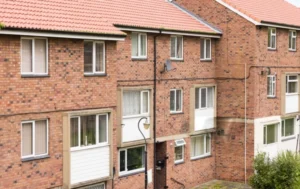 Social-housing-apartment-building-representing-Social-Housing-Investment-Returns-strategies