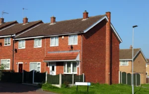 A-residential-property-for-rent-with-a-signpost-asking-How-Much-Can-I-Rent-My-House-For