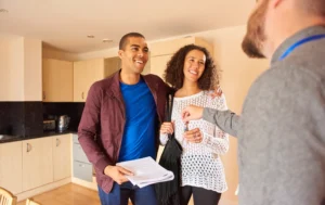Happy-tenants-receiving-keys-after-successful-referencing-and-rental-agreement-in-the-UK
