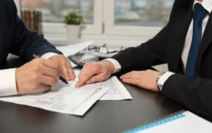 Two-people-signing-a-document-possibly-related-to-a-rental-or-tax-agreement-with-focus-on-the-Council-Tax-When-Renting