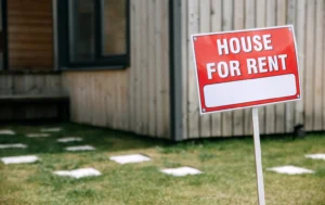 House-for-rent-sign-on-property-representing-Rental-Assurance