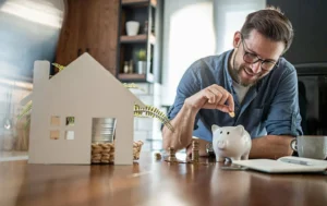Investor-calculating-care-home-investment-returns-with-piggy-bank
