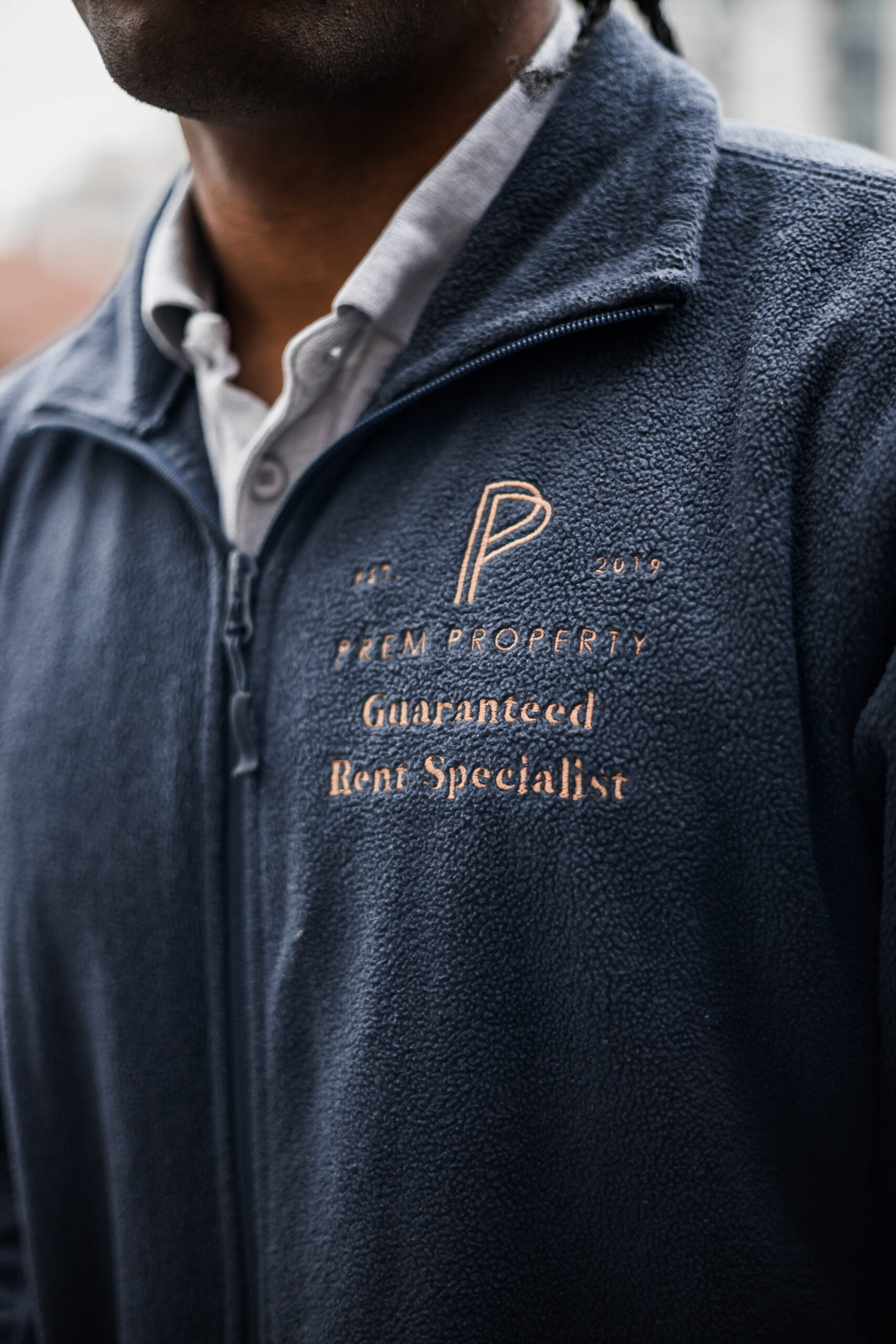 A-Prem-Property-staff-member-wearing-branded-clothing-highlighting-their-expertise-in-guaranteed-rent-solutions