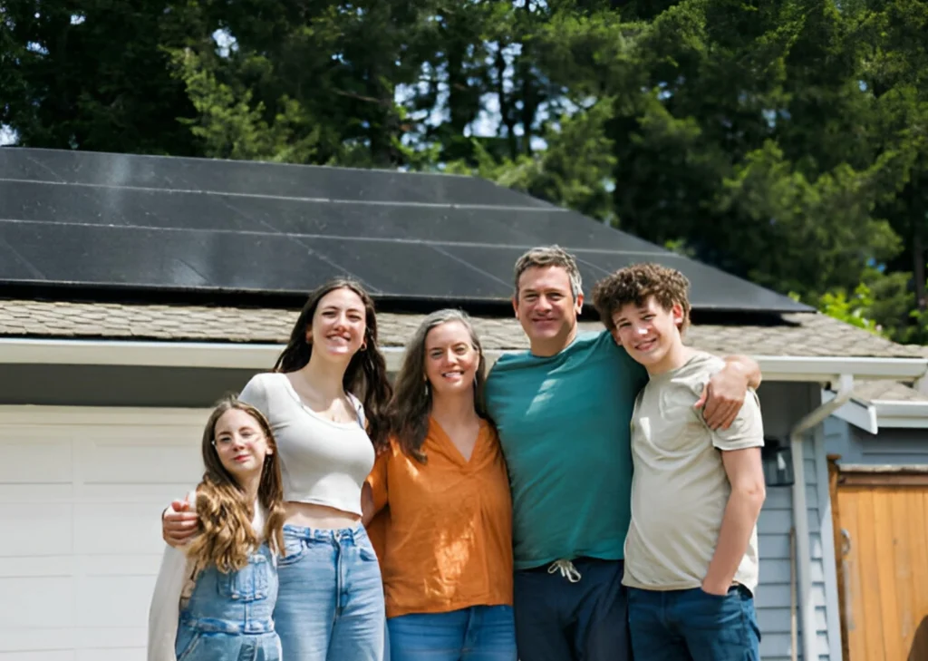 happy-family-together-in-front-of-solar-equipped-home