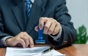 man-stamping-approve-of-lease-agreement