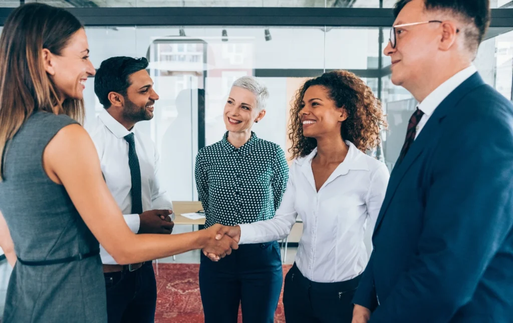 Business-professionals-shaking-hands-in-office–Provider-Updates–Prem-Property