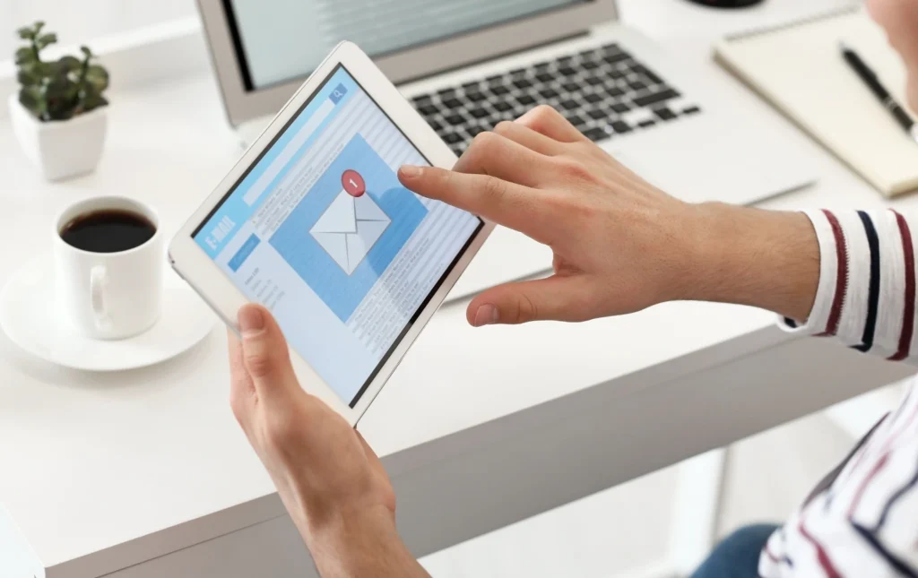 Landlord-checking-updates-on-Prem-property-email-notification-on-tablet