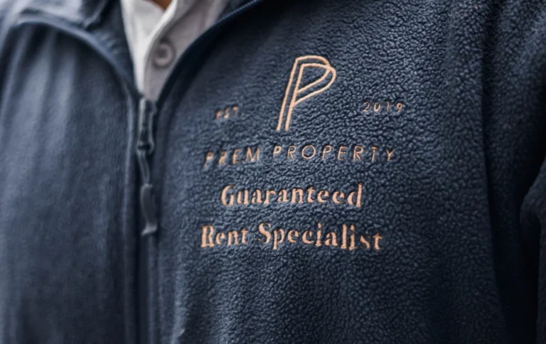 Blue-Jacket-with Prem-Property-Guaranted-Rent-Specialist-logo